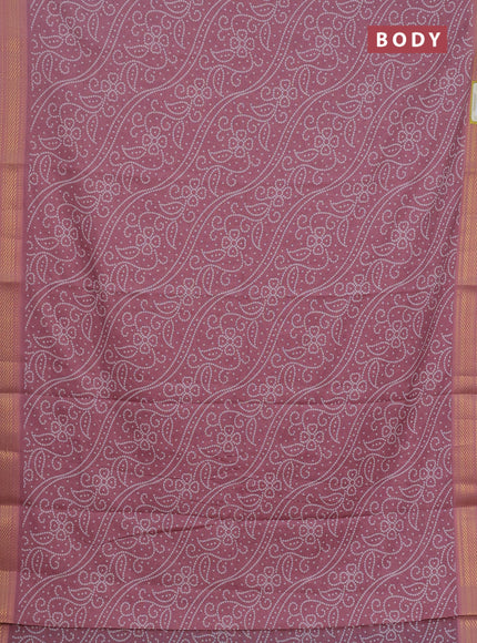Spun cotton saree pink shade with allover bandhani prints and zari woven border