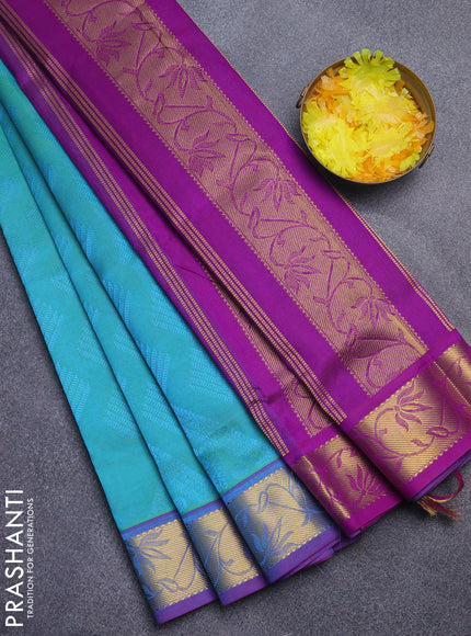 Silk cotton saree dual shade of teal bluish green and purple with allover self emboss jacquard and rich zari woven border