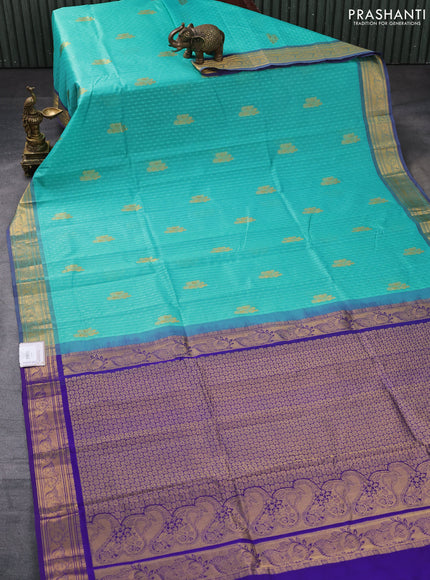 Silk cotton saree teal green and blue with allover self emboss jacquard & zari buttas and rich zari woven border