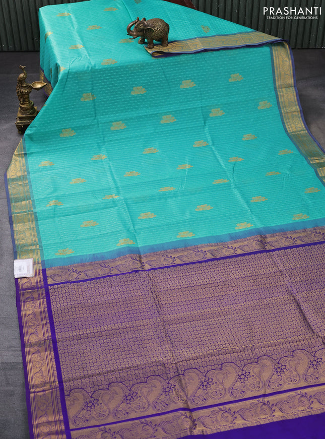Silk cotton saree teal green and blue with allover self emboss jacquard & zari buttas and rich zari woven border