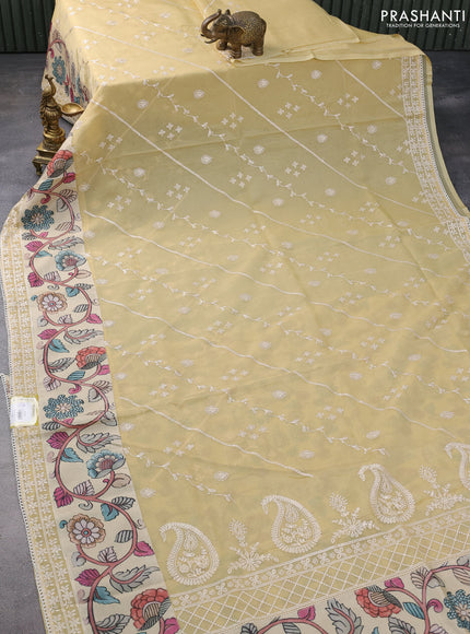 Semi organza saree sandal and beige with allover embroidery work and applique pallu & blouse