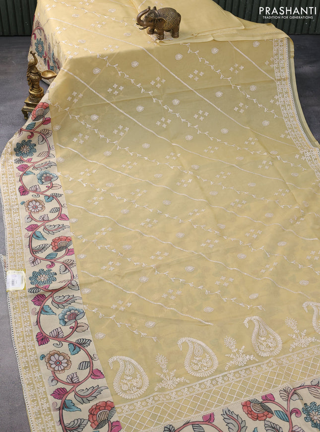 Semi organza saree sandal and beige with allover embroidery work and applique pallu & blouse
