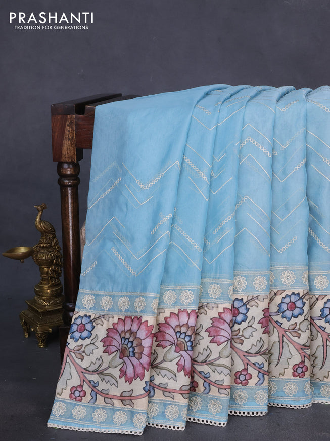 Semi organza saree pastel blue and beige with allover embroidery work and applique pallu & blouse