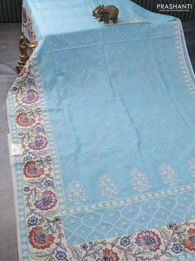 Semi organza saree pastel blue and beige with allover embroidery work and applique pallu & blouse