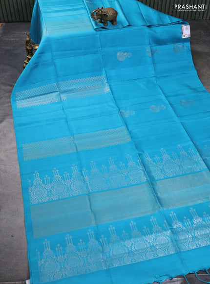 Pure soft silk saree teal blue with silver & gold zari woven peacock buttas in borderless style