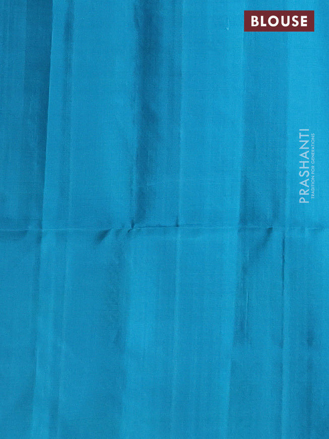 Pure soft silk saree teal blue with silver & gold zari woven peacock buttas in borderless style