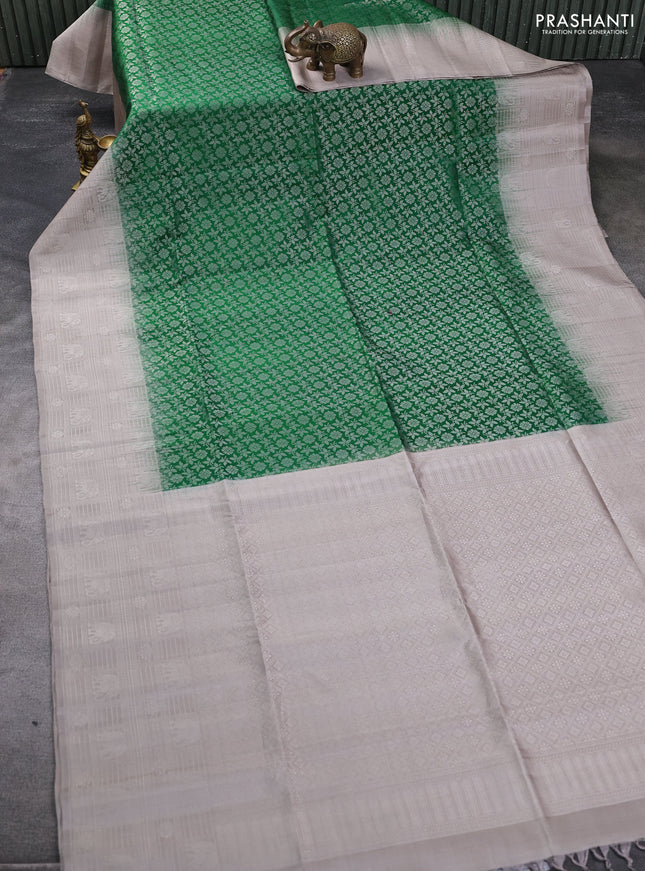 Pure soft silk saree green and pastel grey shade with allover silver zari brocade weaves and long silver zari woven border