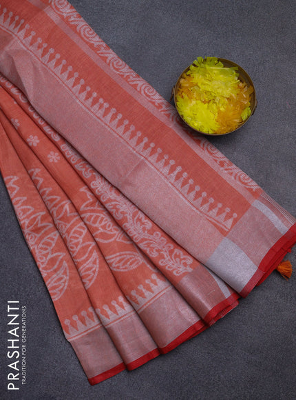 Pure linen saree pale orange and red with allover prints and silver zari woven border