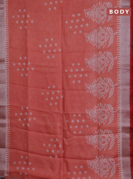 Pure linen saree pale orange and red with allover prints and silver zari woven border