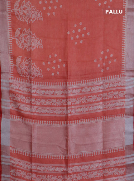 Pure linen saree pale orange and red with allover prints and silver zari woven border