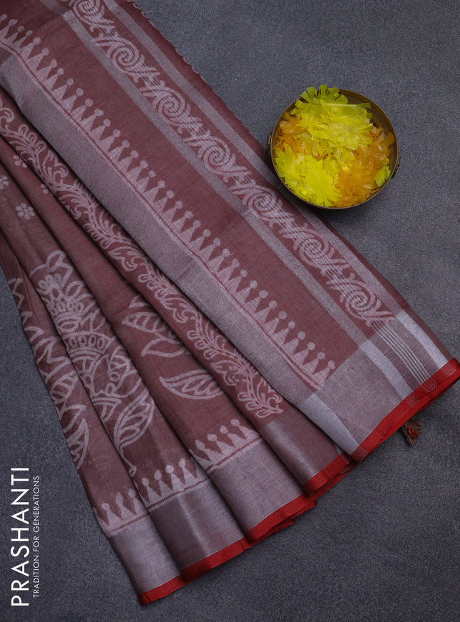 Pure linen saree pastel brown and red with allover prints and silver zari woven border