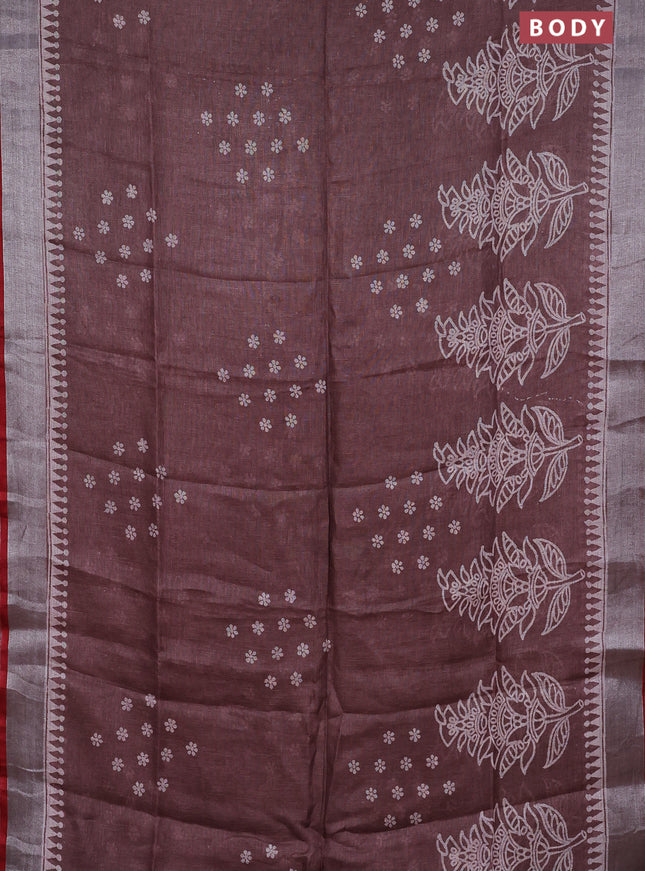 Pure linen saree pastel brown and red with allover prints and silver zari woven border