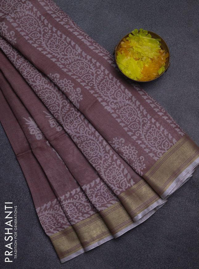 Pure linen saree pastel brown with allover prints and silver zari woven border