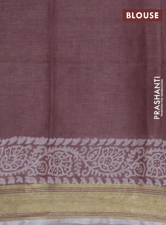 Pure linen saree pastel brown with allover prints and silver zari woven border