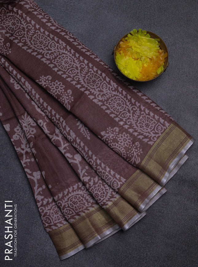 Pure linen saree pastel brown with allover prints and silver zari woven border