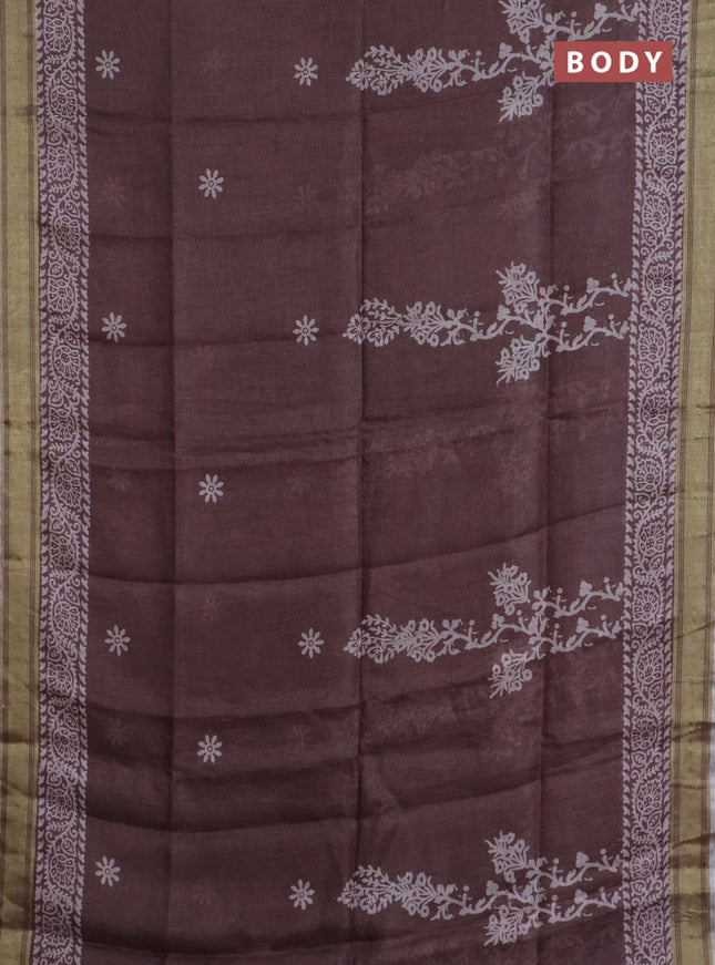 Pure linen saree pastel brown with allover prints and silver zari woven border