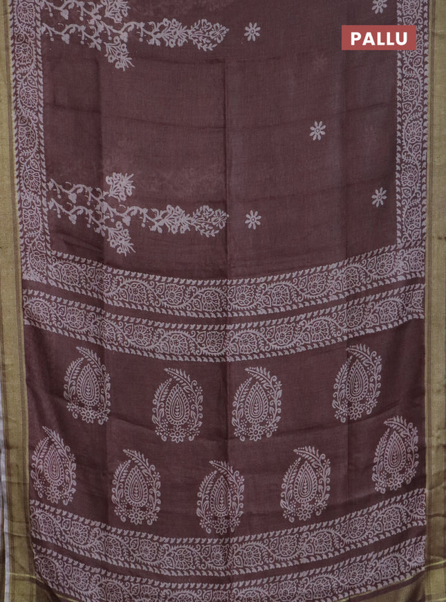 Pure linen saree pastel brown with allover prints and silver zari woven border