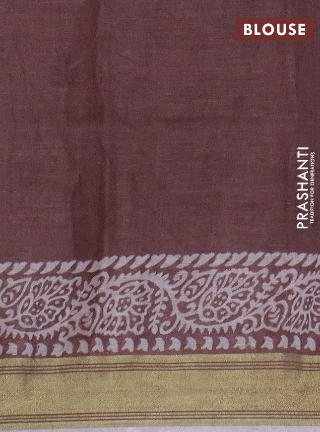Pure linen saree pastel brown with allover prints and silver zari woven border