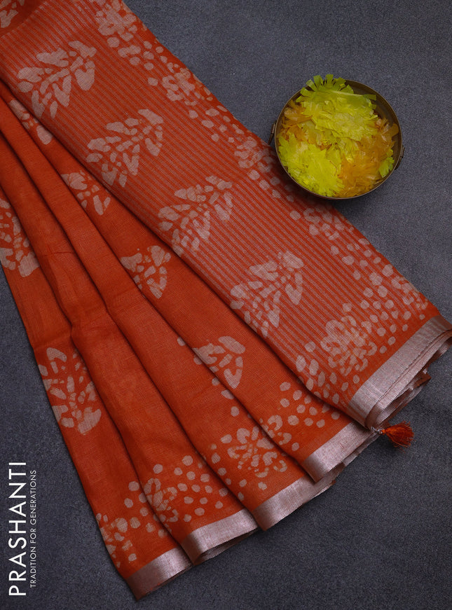 Pure linen saree orange with allover batik butta prints and silver zari woven border