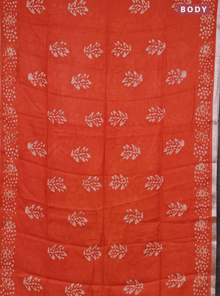 Pure linen saree orange with allover batik butta prints and silver zari woven border