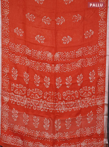 Pure linen saree orange with allover batik butta prints and silver zari woven border