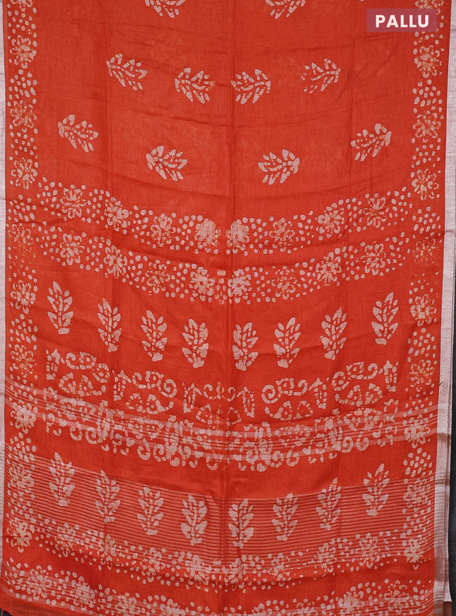 Pure linen saree orange with allover batik butta prints and silver zari woven border