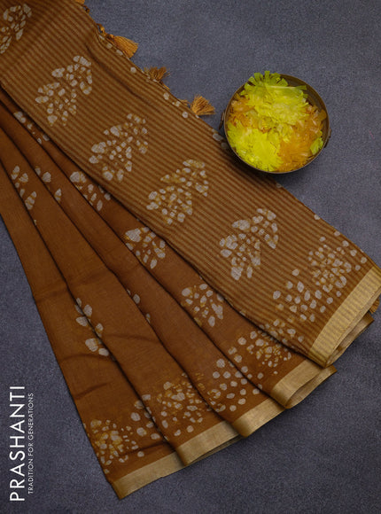 Pure linen saree dark mustard with allover batik butta prints and silver zari woven border