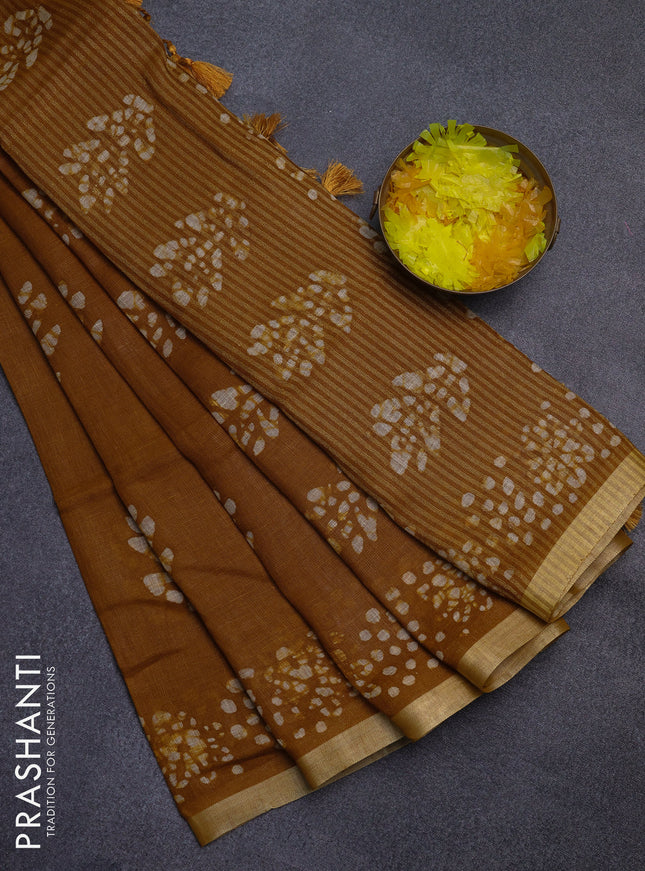 Pure linen saree dark mustard with allover batik butta prints and silver zari woven border