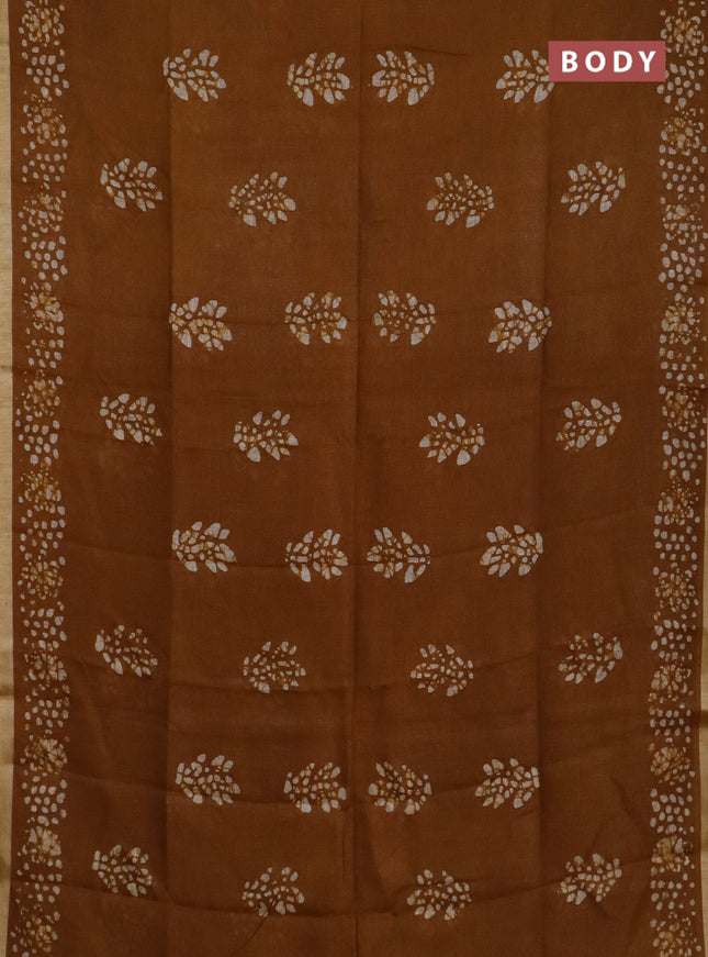 Pure linen saree dark mustard with allover batik butta prints and silver zari woven border
