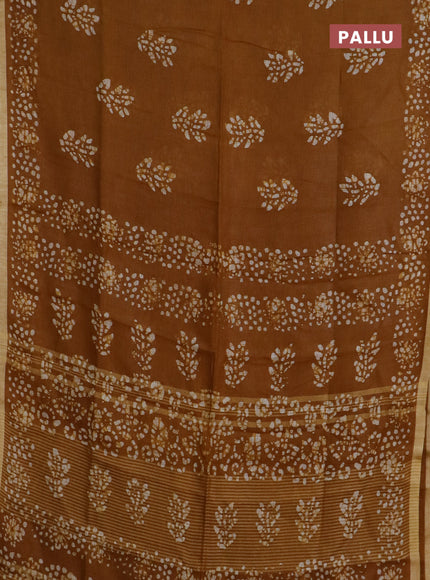 Pure linen saree dark mustard with allover batik butta prints and silver zari woven border