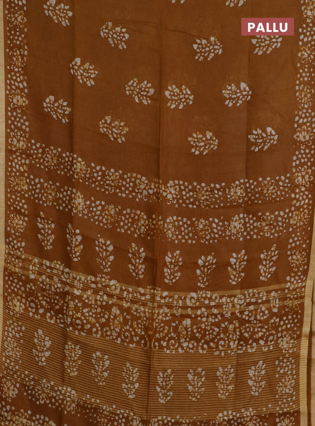 Pure linen saree dark mustard with allover batik butta prints and silver zari woven border