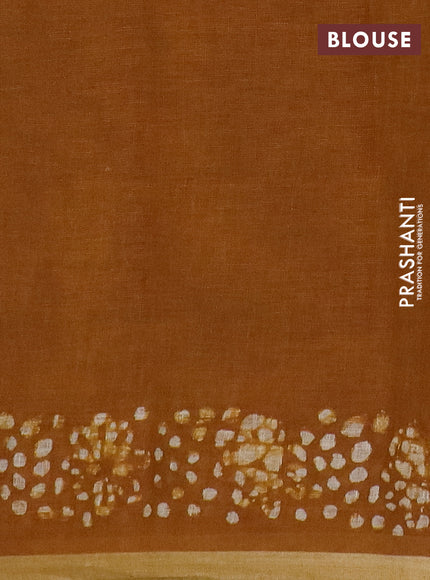 Pure linen saree dark mustard with allover batik butta prints and silver zari woven border