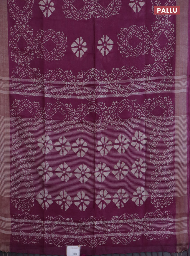Pure linen saree wine shade with allover batik prints and silver zari woven border