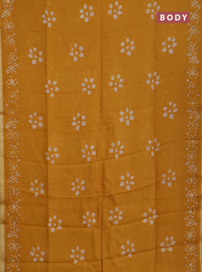 Pure linen saree mustard yellow with batik butta prints and silver zari woven border