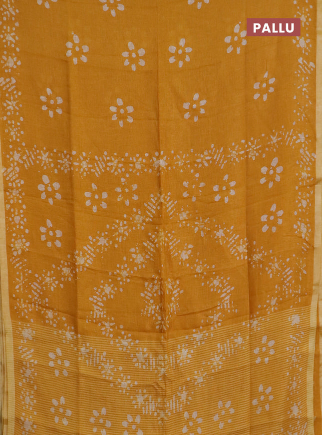 Pure linen saree mustard yellow with batik butta prints and silver zari woven border