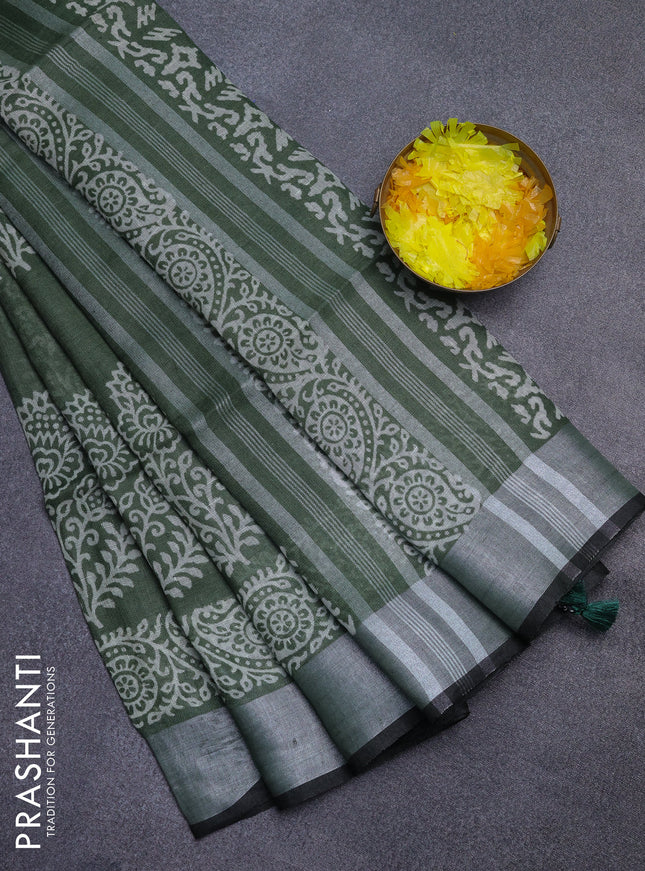 Pure linen saree sap green and black with butta prints and silver zari woven border