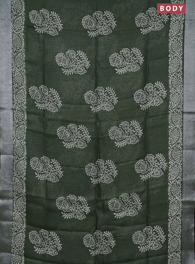 Pure linen saree sap green and black with butta prints and silver zari woven border