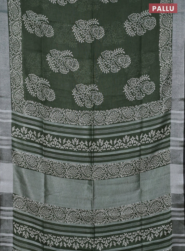 Pure linen saree sap green and black with butta prints and silver zari woven border