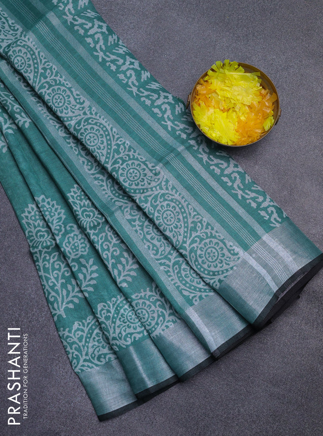 Pure linen saree green and black with butta prints and silver zari woven border