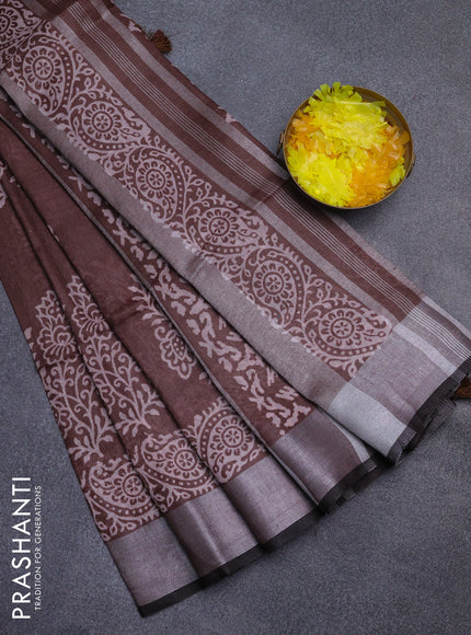 Pure linen saree brown with butta prints and silver zari woven border