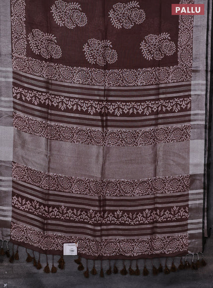 Pure linen saree brown with butta prints and silver zari woven border