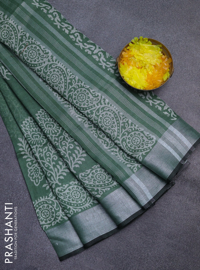 Pure linen saree green shade with butta prints and silver zari woven border