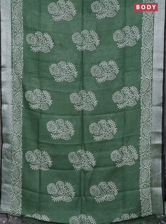 Pure linen saree green shade with butta prints and silver zari woven border