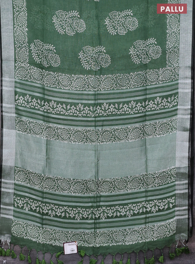 Pure linen saree green shade with butta prints and silver zari woven border