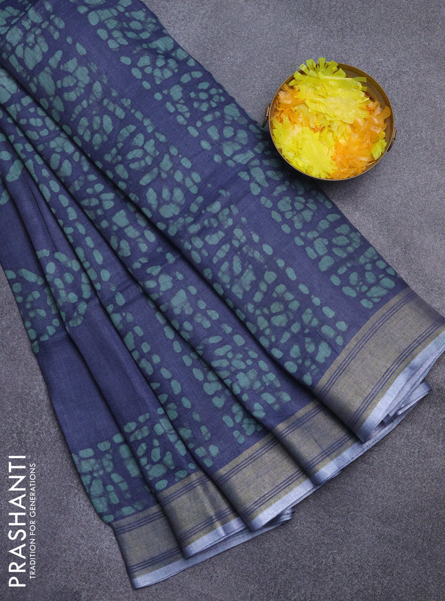 Pure linen saree bluish grey with batik butta prints and silver zari woven border