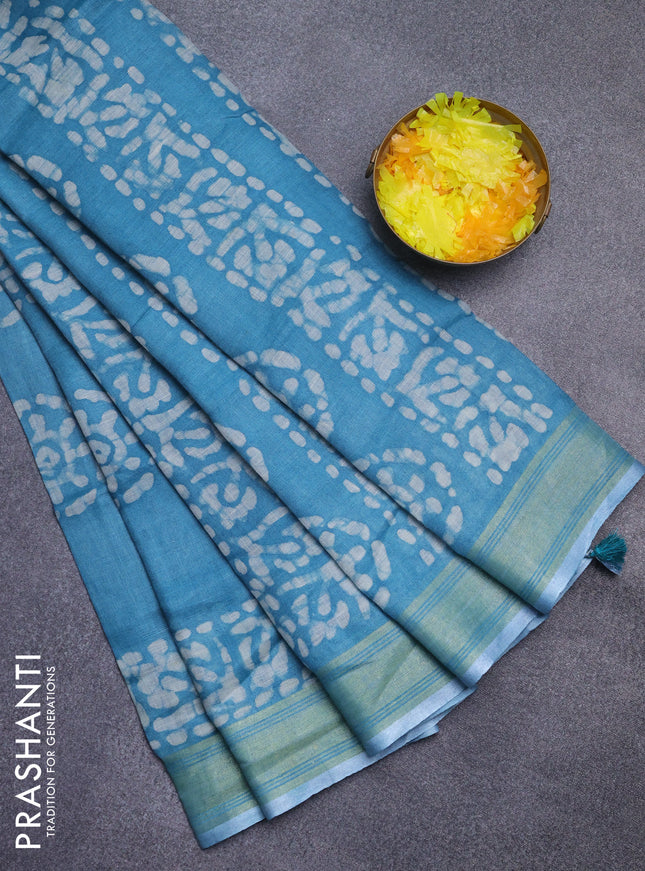 Pure linen saree teal blue with batik butta prints and silver zari woven border