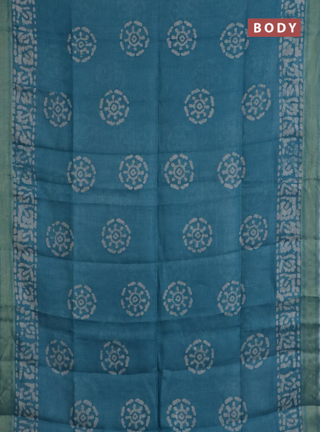 Pure linen saree teal blue with batik butta prints and silver zari woven border