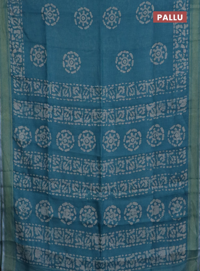 Pure linen saree teal blue with batik butta prints and silver zari woven border