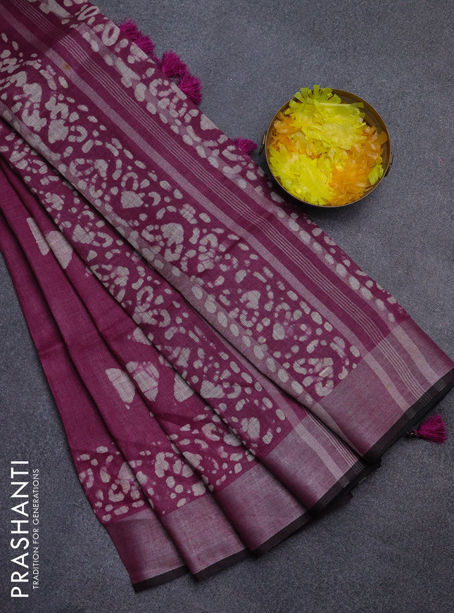 Pure linen saree wine shade with batik butta prints and silver zari woven border