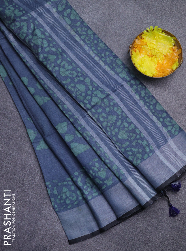 Pure linen saree greyish blue and pastel green with batik butta prints and zari woven border